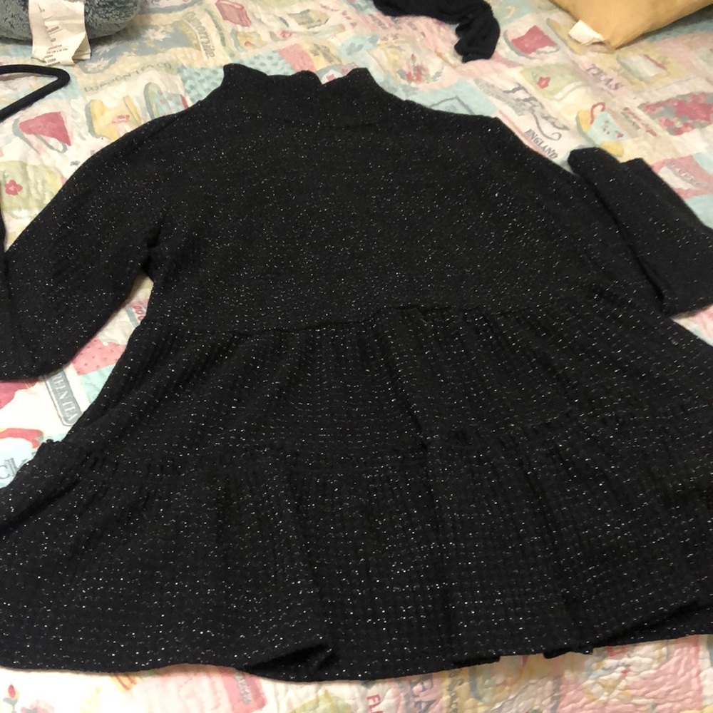 Lauren Conrad black with silver threads all through it. Long sleeve turtle neck